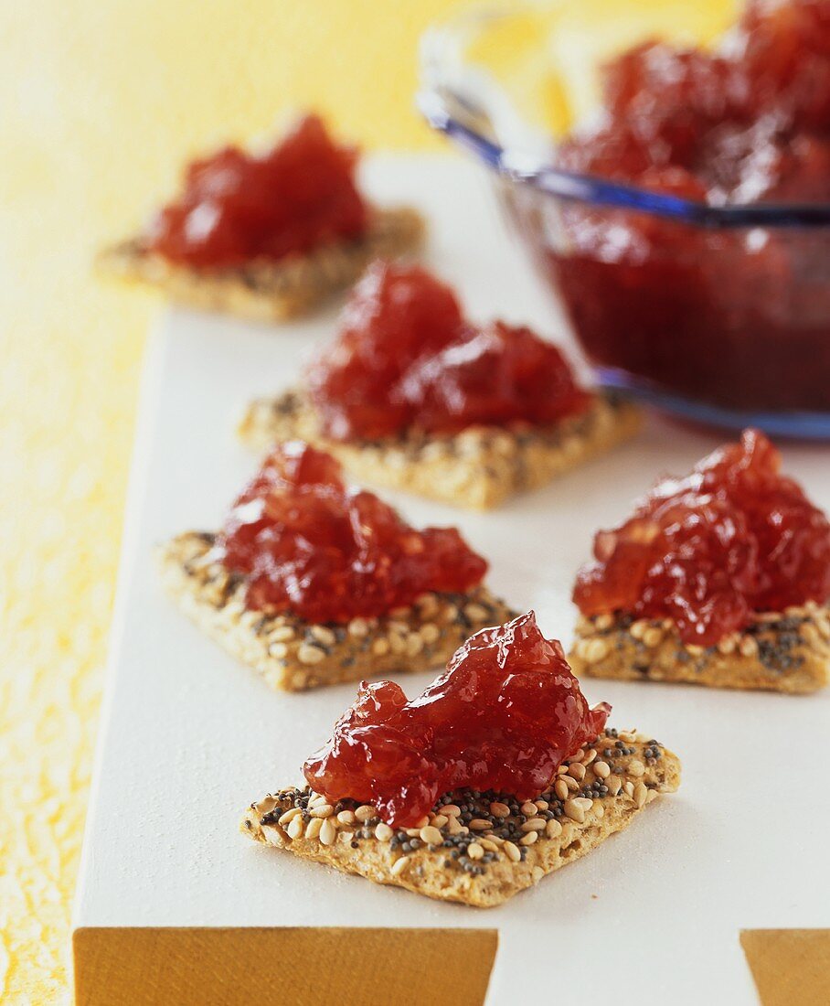 Redcurrant and apple jam on wholemeal crackers