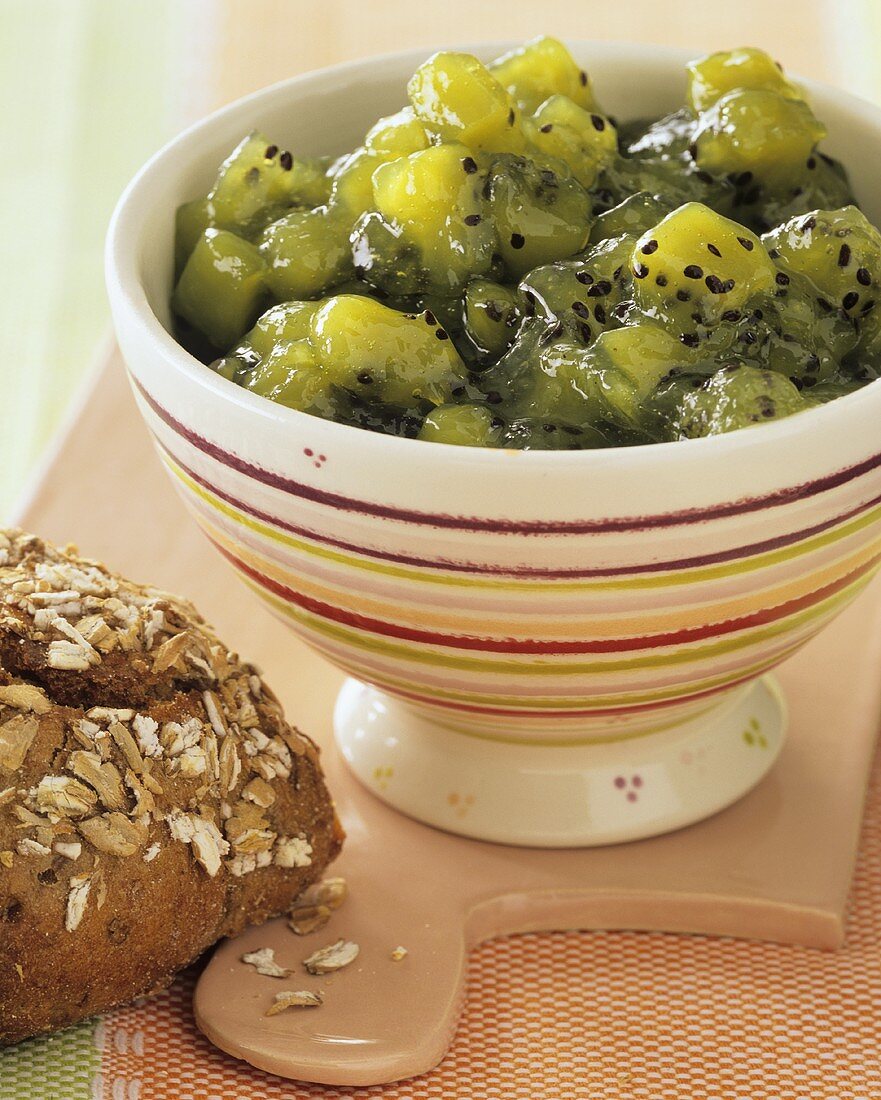 Orange and kiwi fruit jam in a cereal bowl