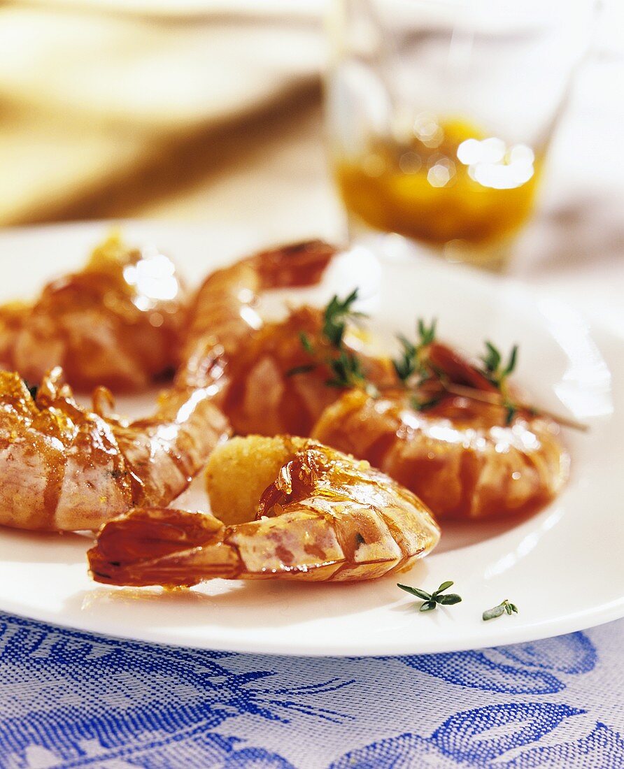 Unpeeled fried shrimps on a plate