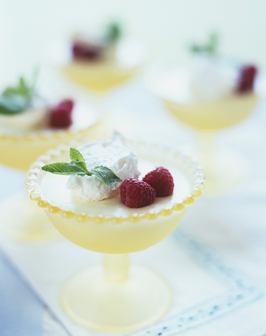 Lemon mousse with raspberries and whipped cream