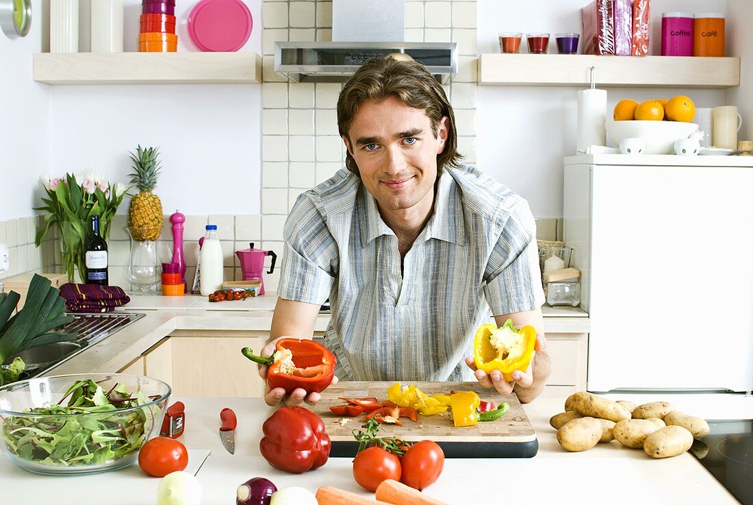 Man in kitchen with fresh vegetables