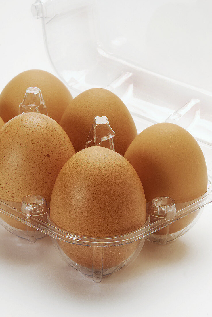 Brown eggs in an egg box