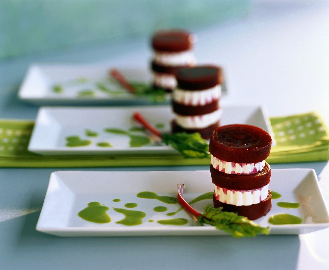 Towers of beetroot and goat’s cheese on parsley sauce
