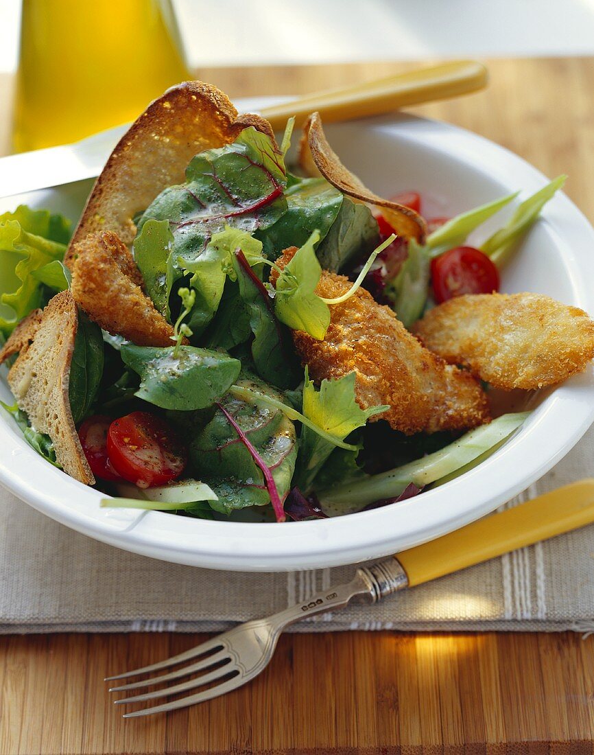 Bread salad with pieces of fried carp