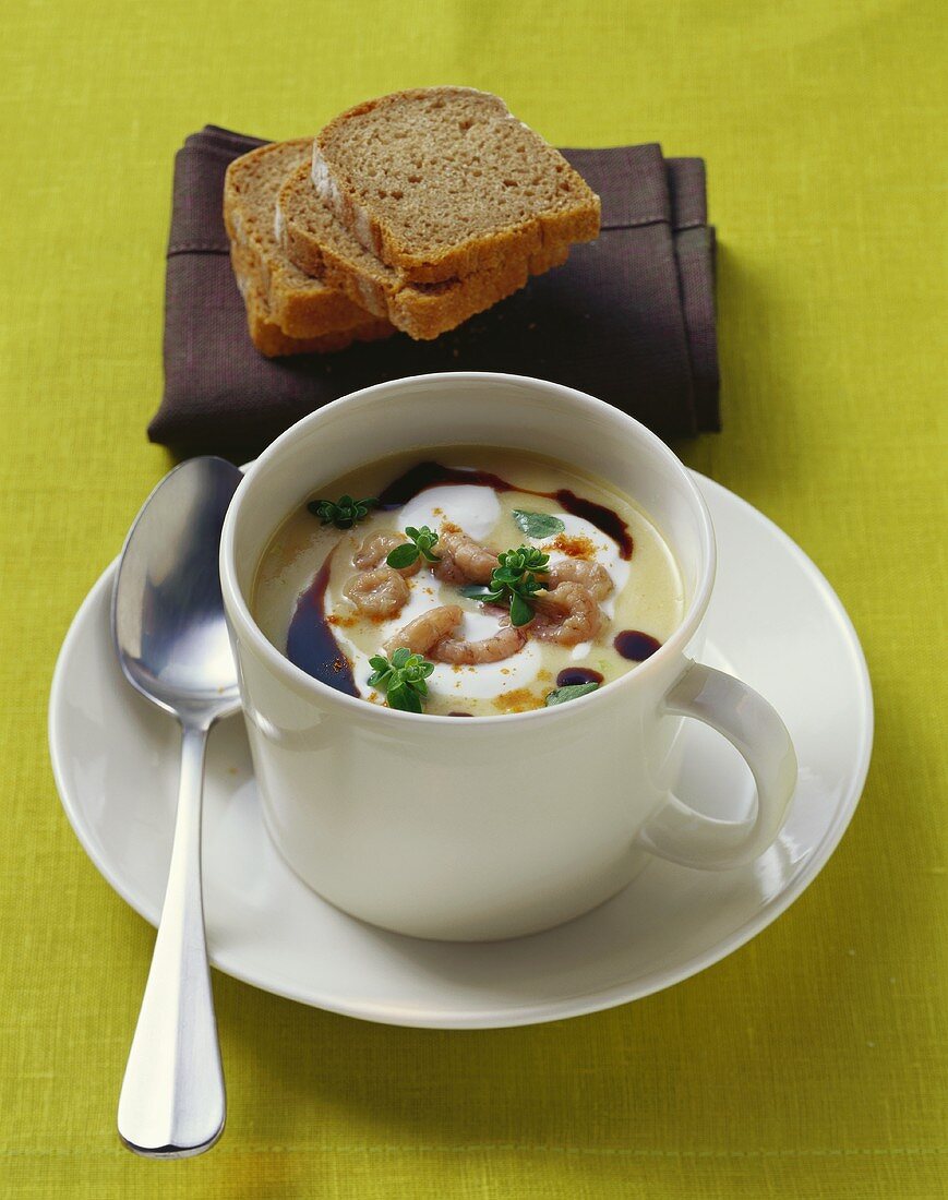 Potato soup with shrimps and fresh marjoram in cup