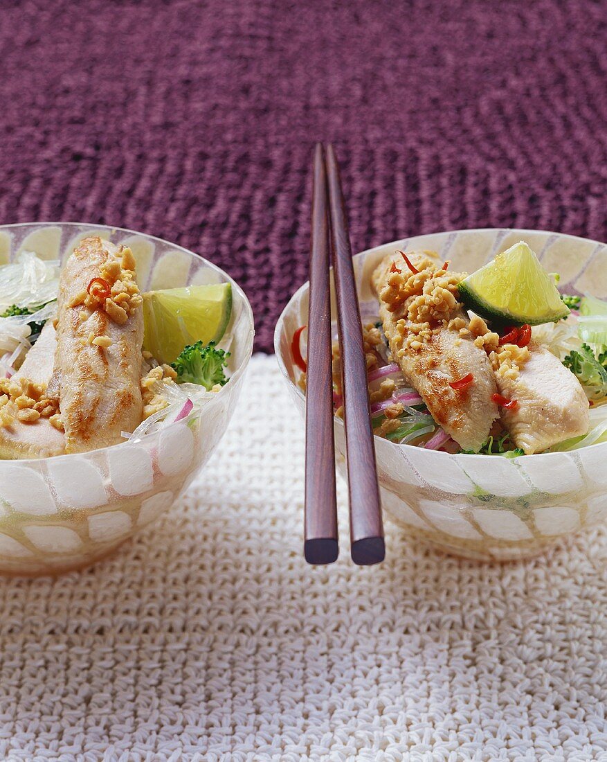 Fried rabbit fillet with peanuts on glass noodle salad