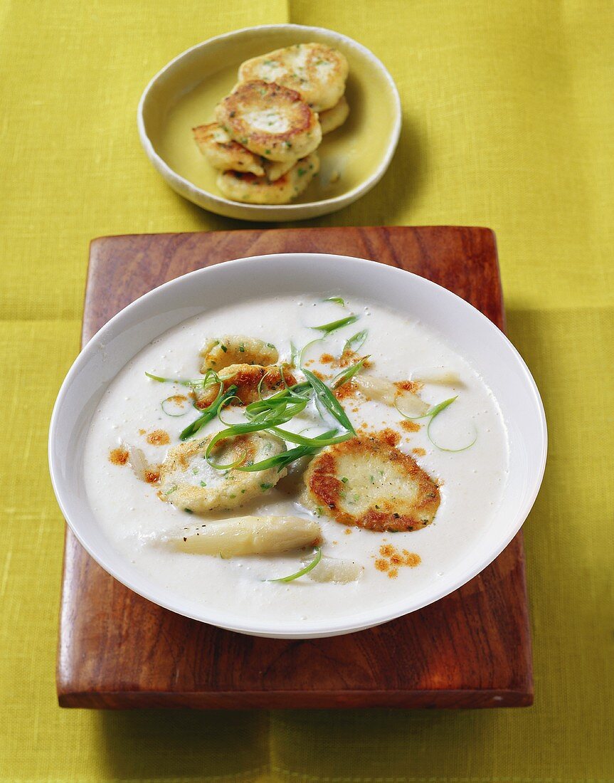 Asparagus cream soup with ricotta cakes and chives