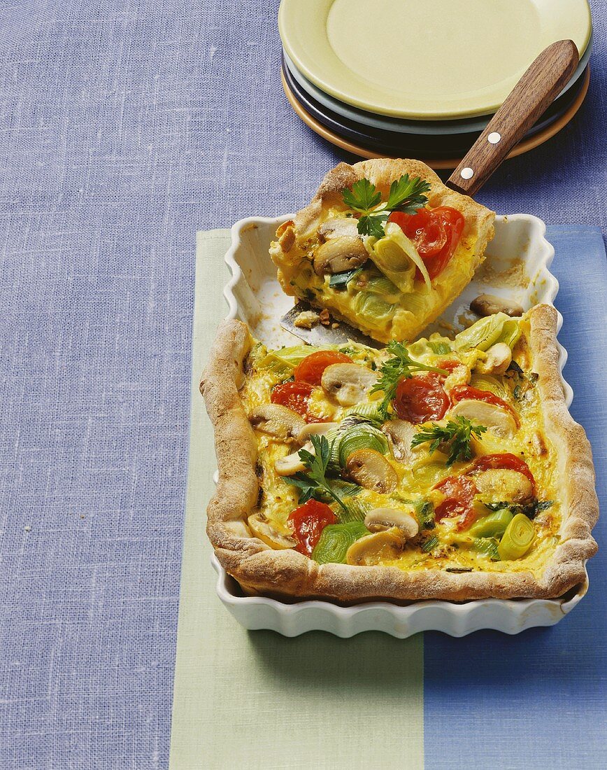 Mushroom, leek & cherry tomato quiche with potato pastry