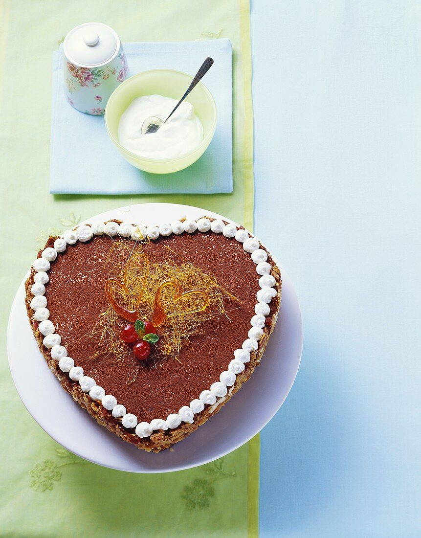Heart-shaped Florentine cake decorated with cocoa & caramel