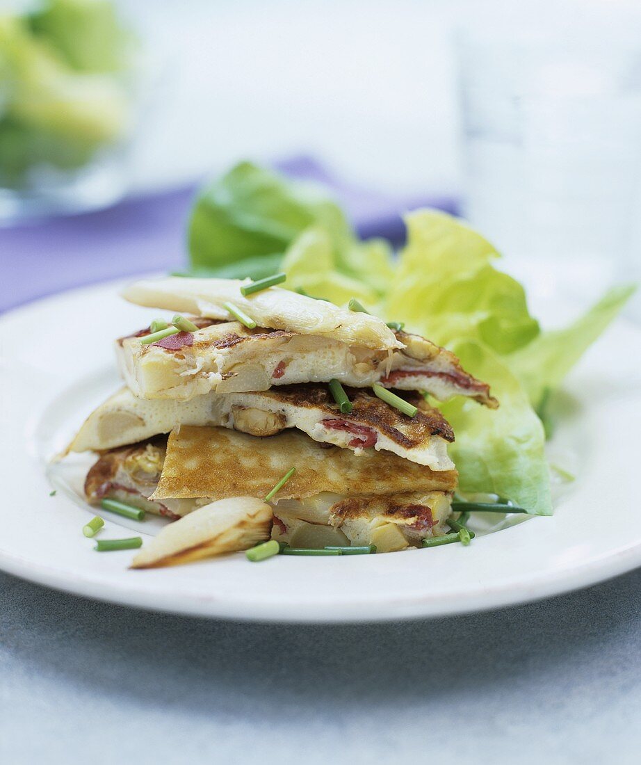 Cheese and asparagus tortilla with lettuce