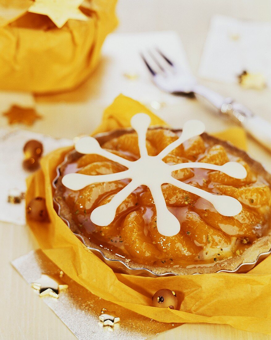 Mandarin and peanut tart with white chocolate star