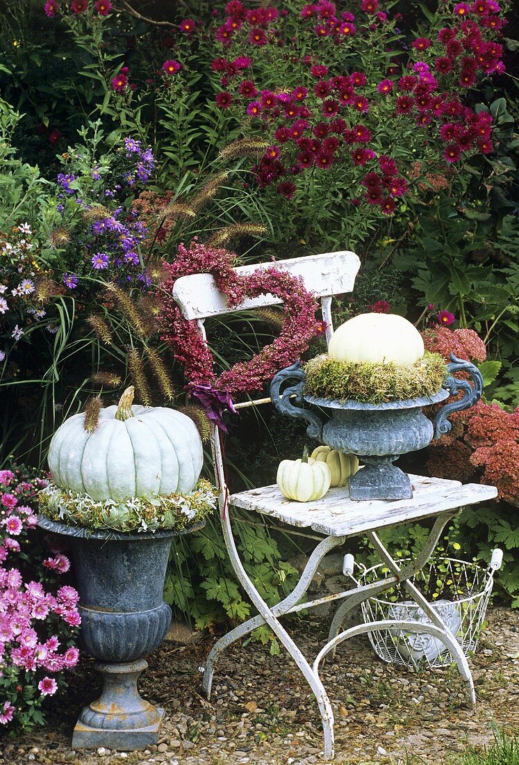 Autumn arrangement centred around garden chair