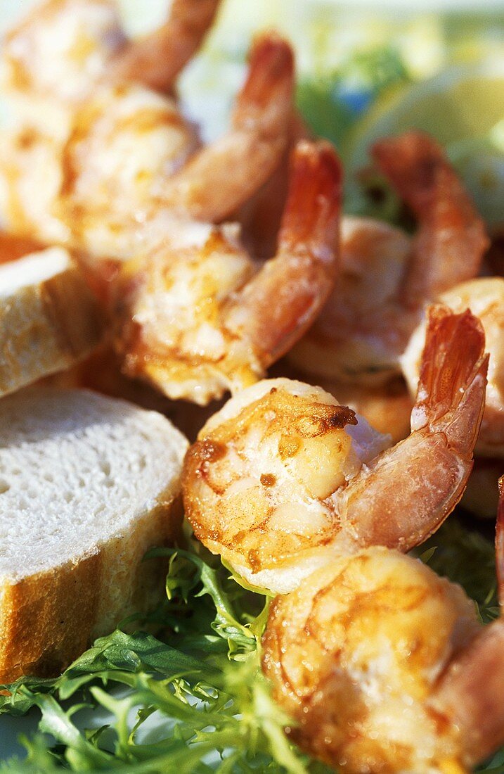 Shrimp skewers on salad