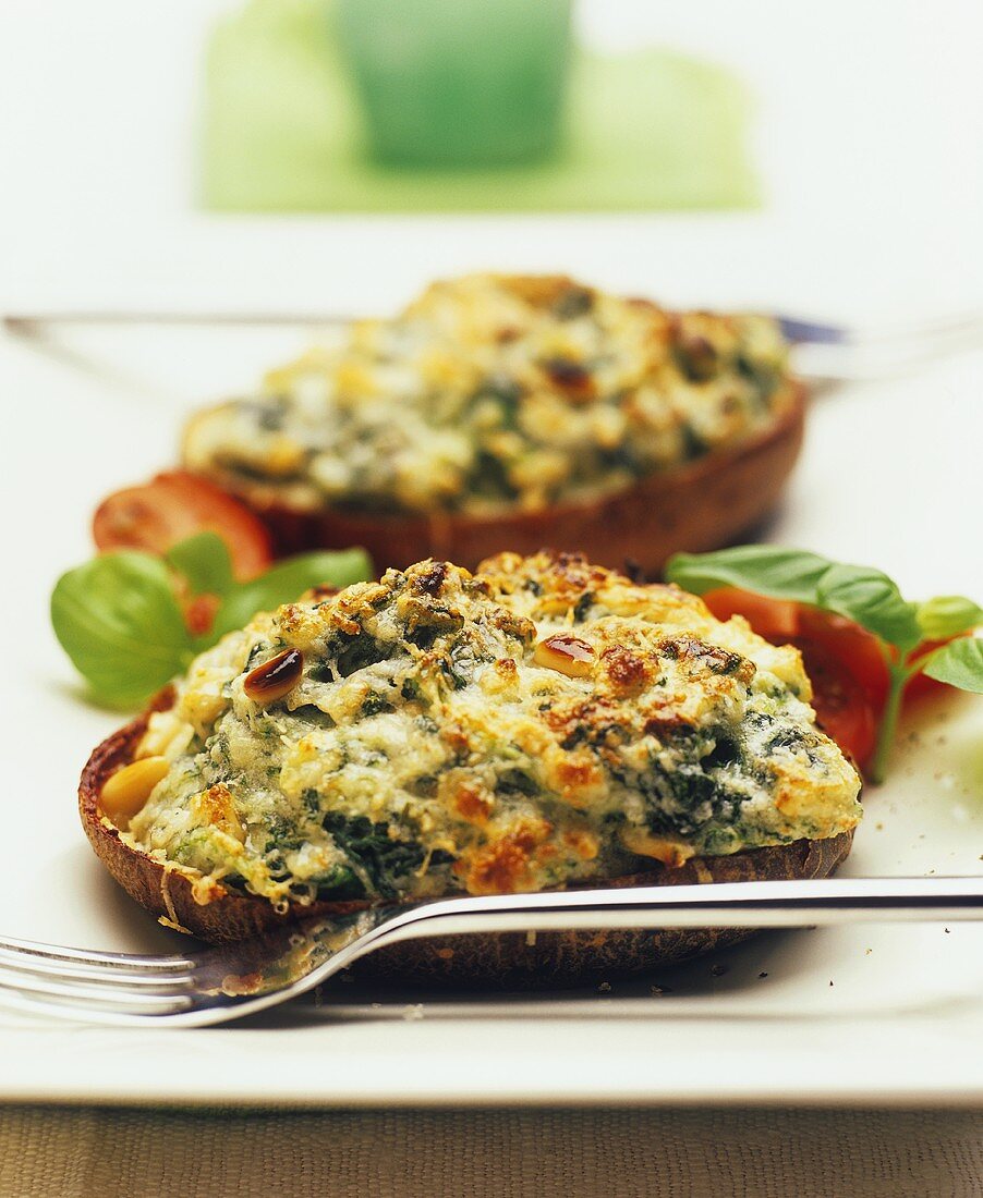 Baked potatoes with cheese and spinach crust