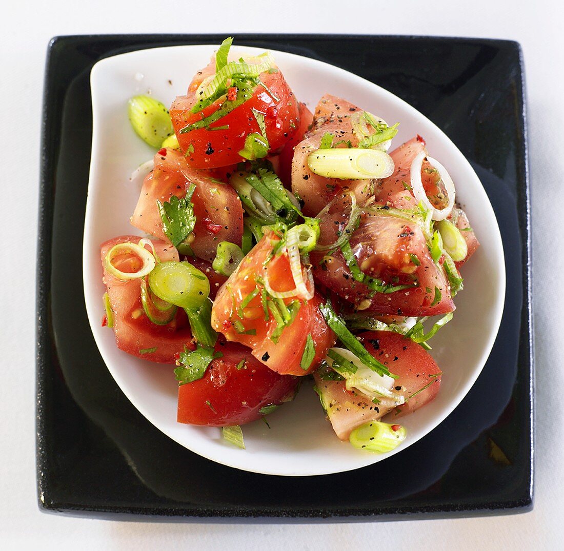 Tomato salad with spring onions, chilli and coriander