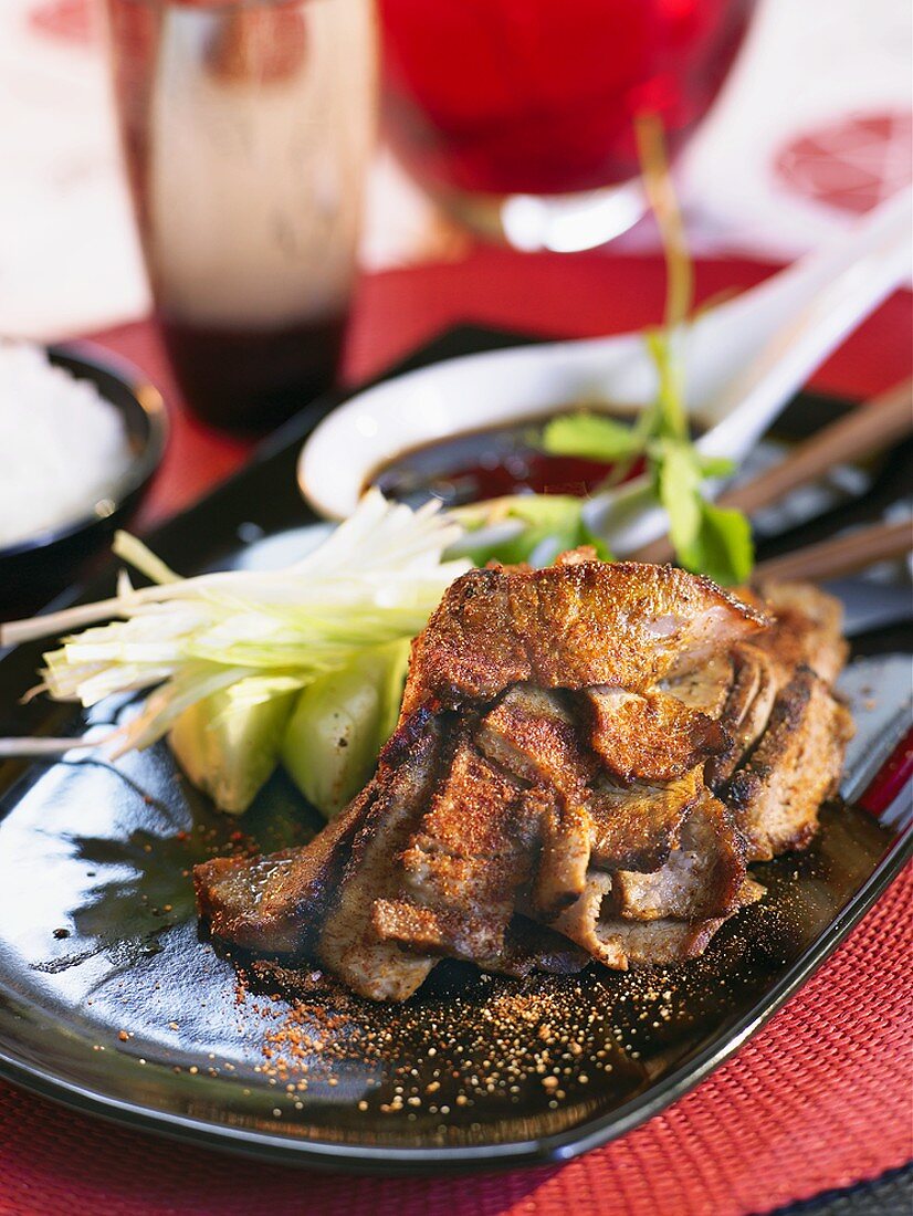 Grilled meat with Chinese seasoning and cucumber salad