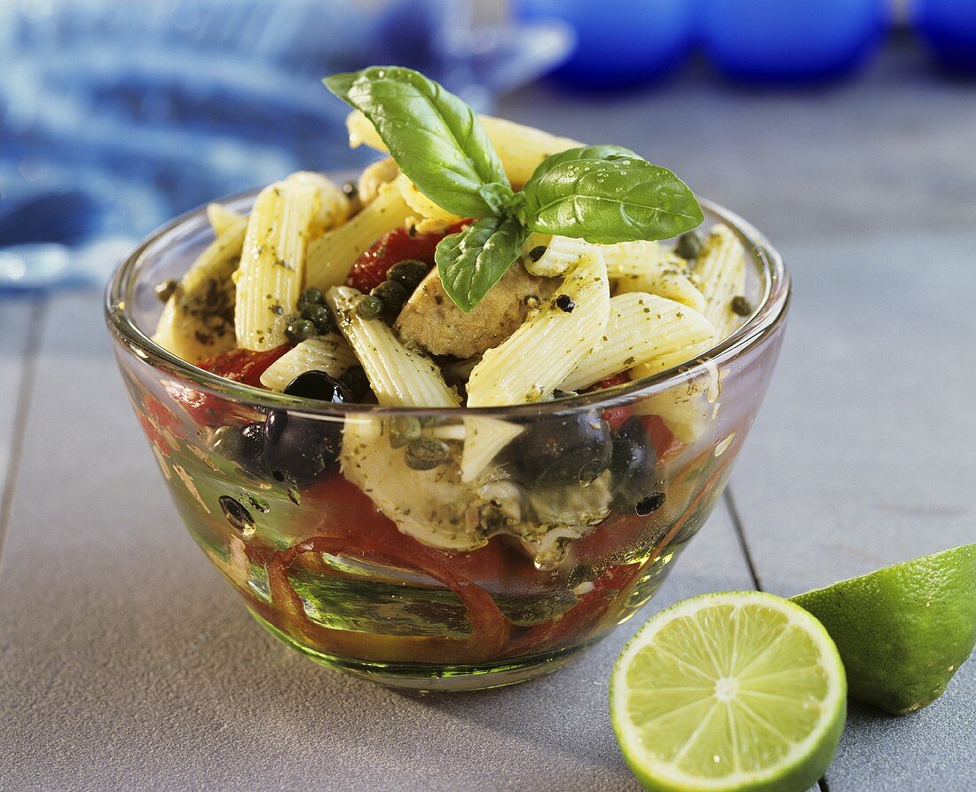 Pasta salad with tomatoes, olives and capers