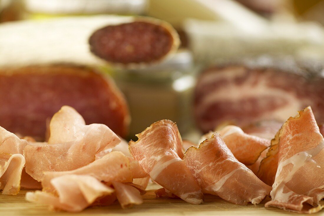 Still life with ham and Schinkenspeck (dry-cured pork)