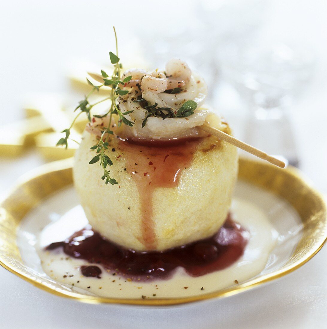 Apple stuffed with seafood salad and cranberry sauce