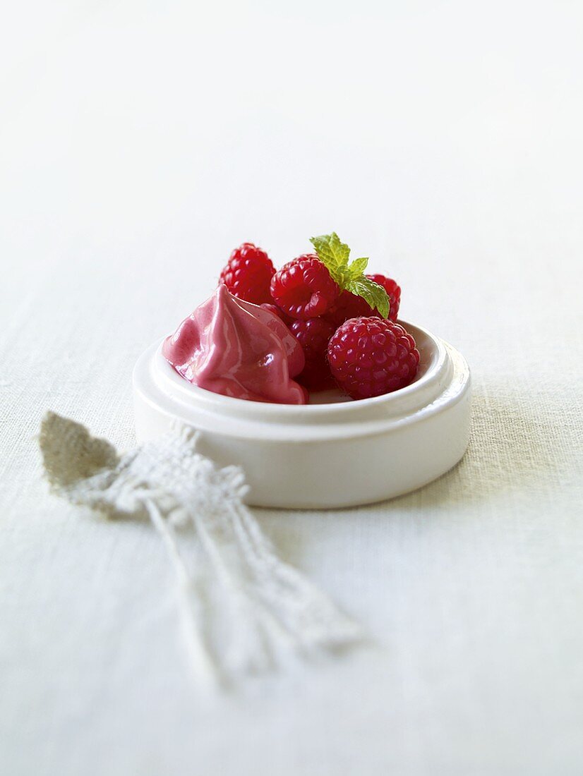 Raspberry ice cream and fresh raspberries