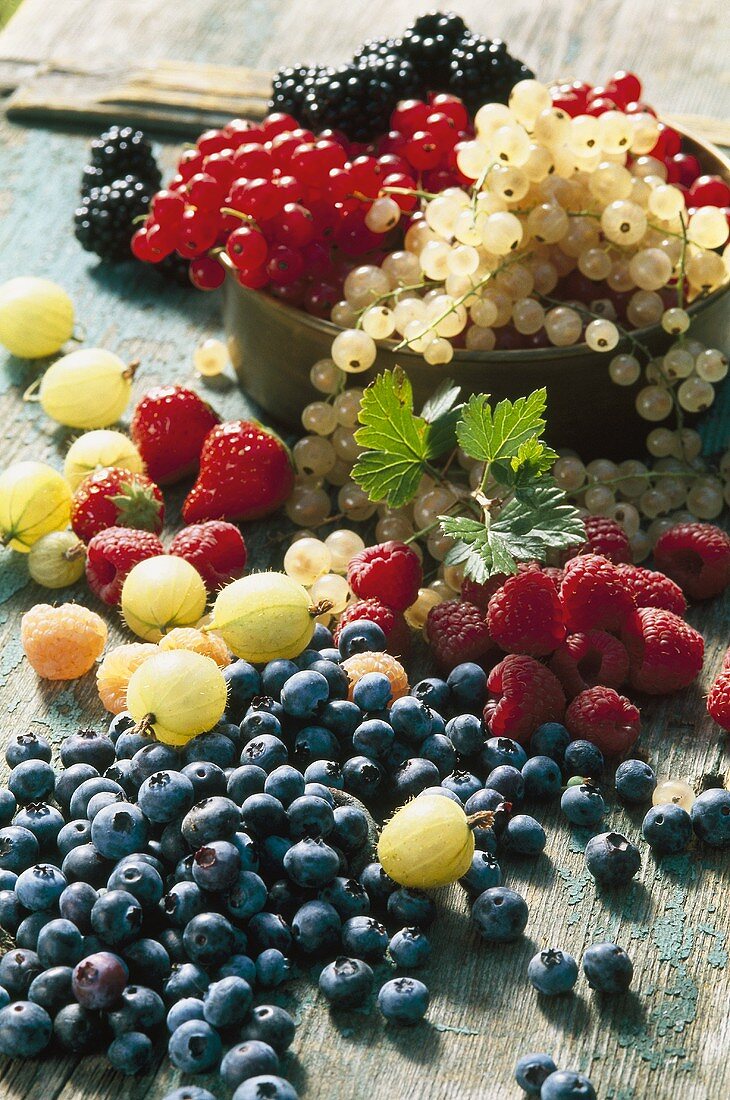 Mixed berries on wooden background
