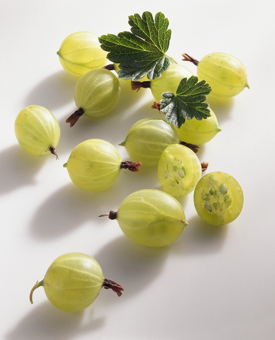 Several gooseberries on light background