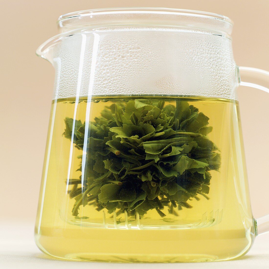 Green tea in glass jug