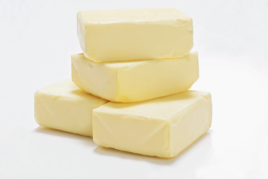 Four pieces of butter in a pile