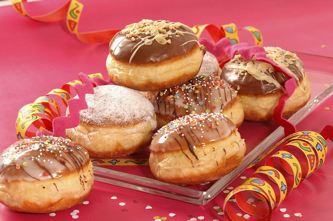Several Carnival doughnuts on a platter