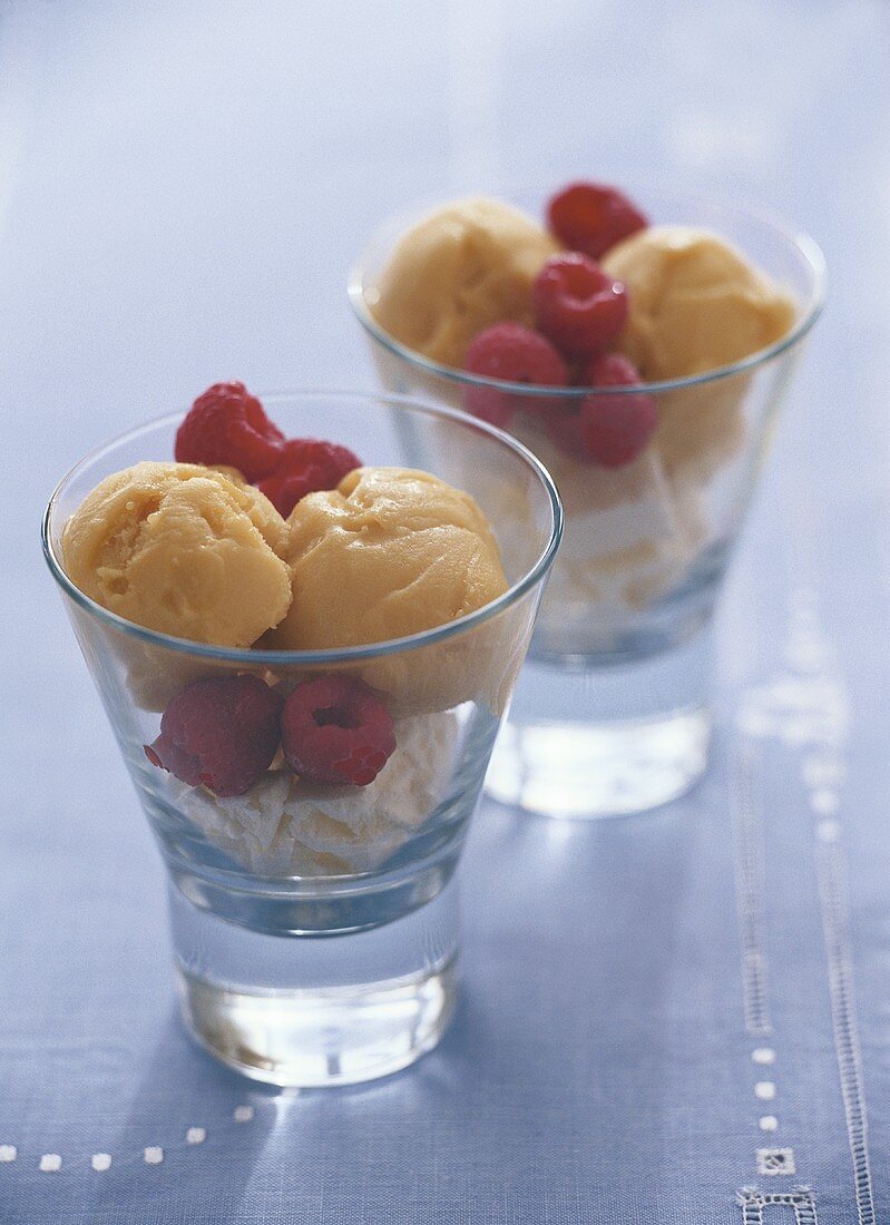 Vanilla and mango ice cream with raspberries