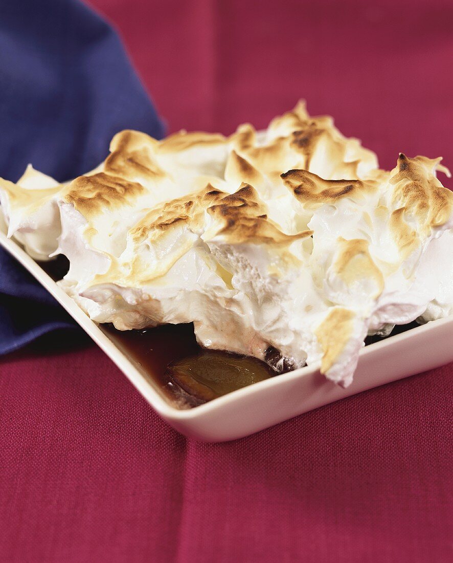 Plum compote with meringue topping