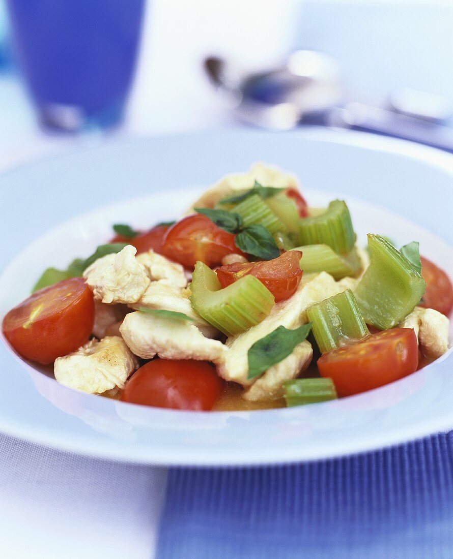 Strips of chicken breast with tomatoes and celery