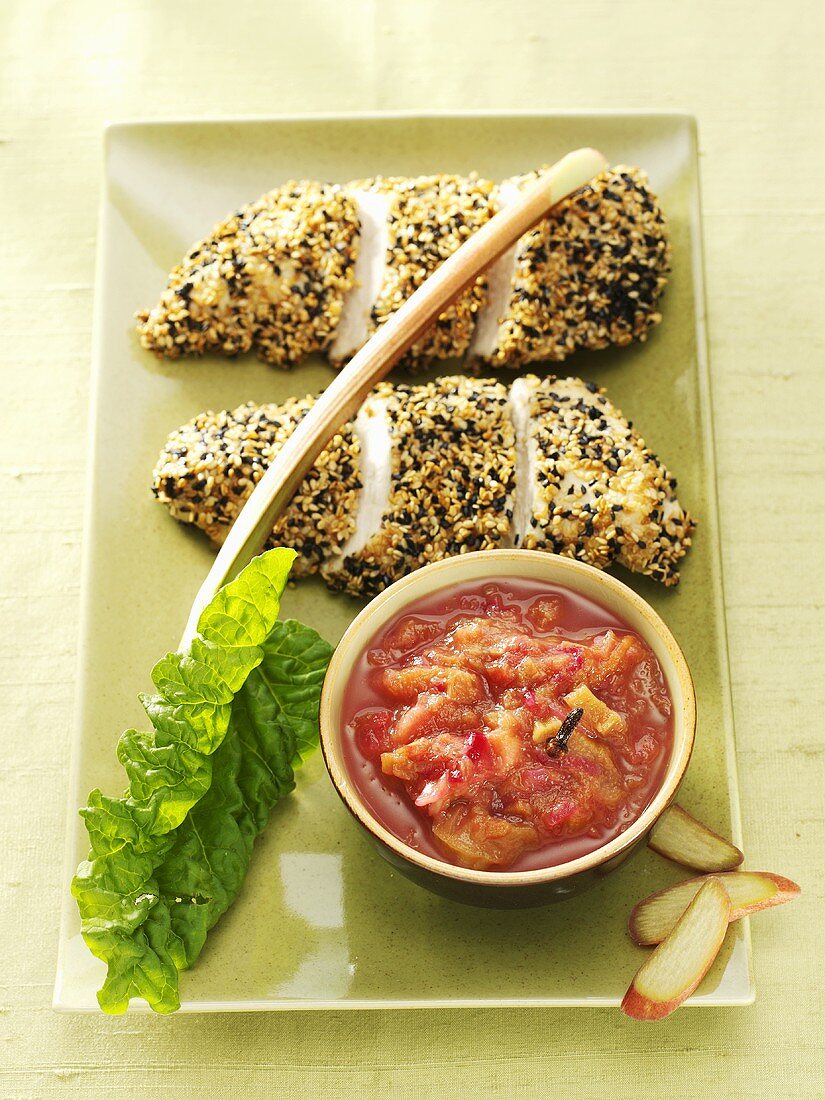 Two chicken breasts with sesame crust and rhubarb chutney