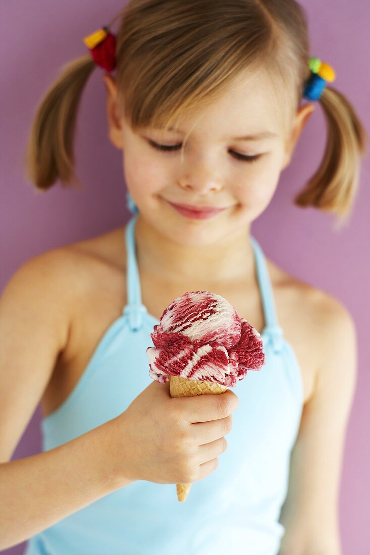 Small girl holding Amarena cherry ice cream