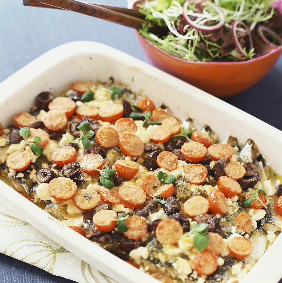 Herring bake with tomatoes, feta and olives