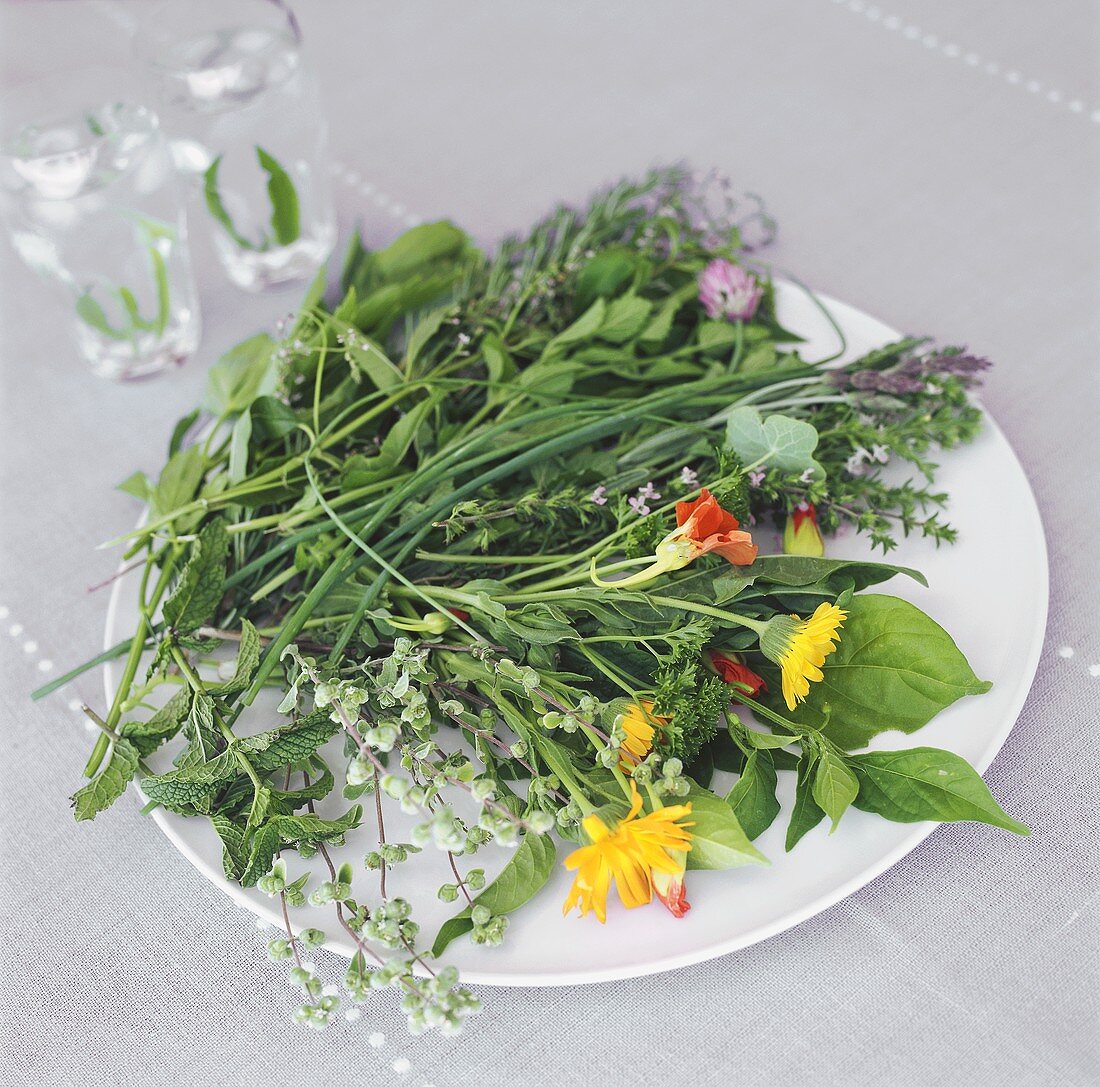 Mixed herbs and flowers on a plate