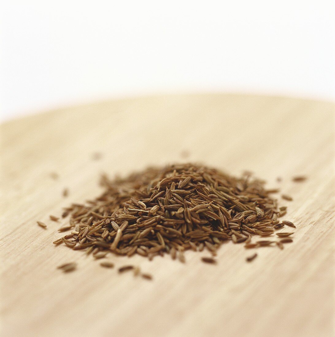 Caraway seed on a wooden platter