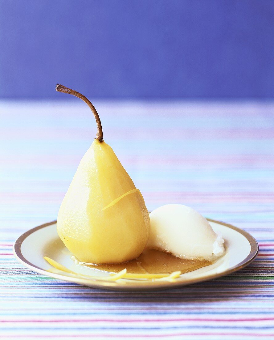 Poached pear with a scoop of ice cream