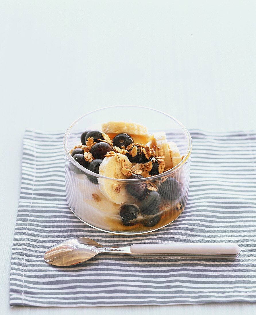 Yoghurt with muesli, banana, blueberry and honey