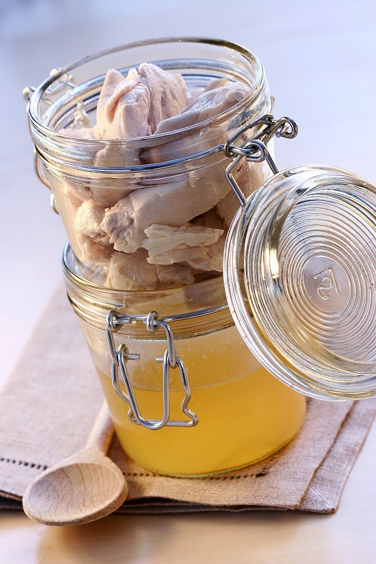 Chicken stock and chicken in preserving jars
