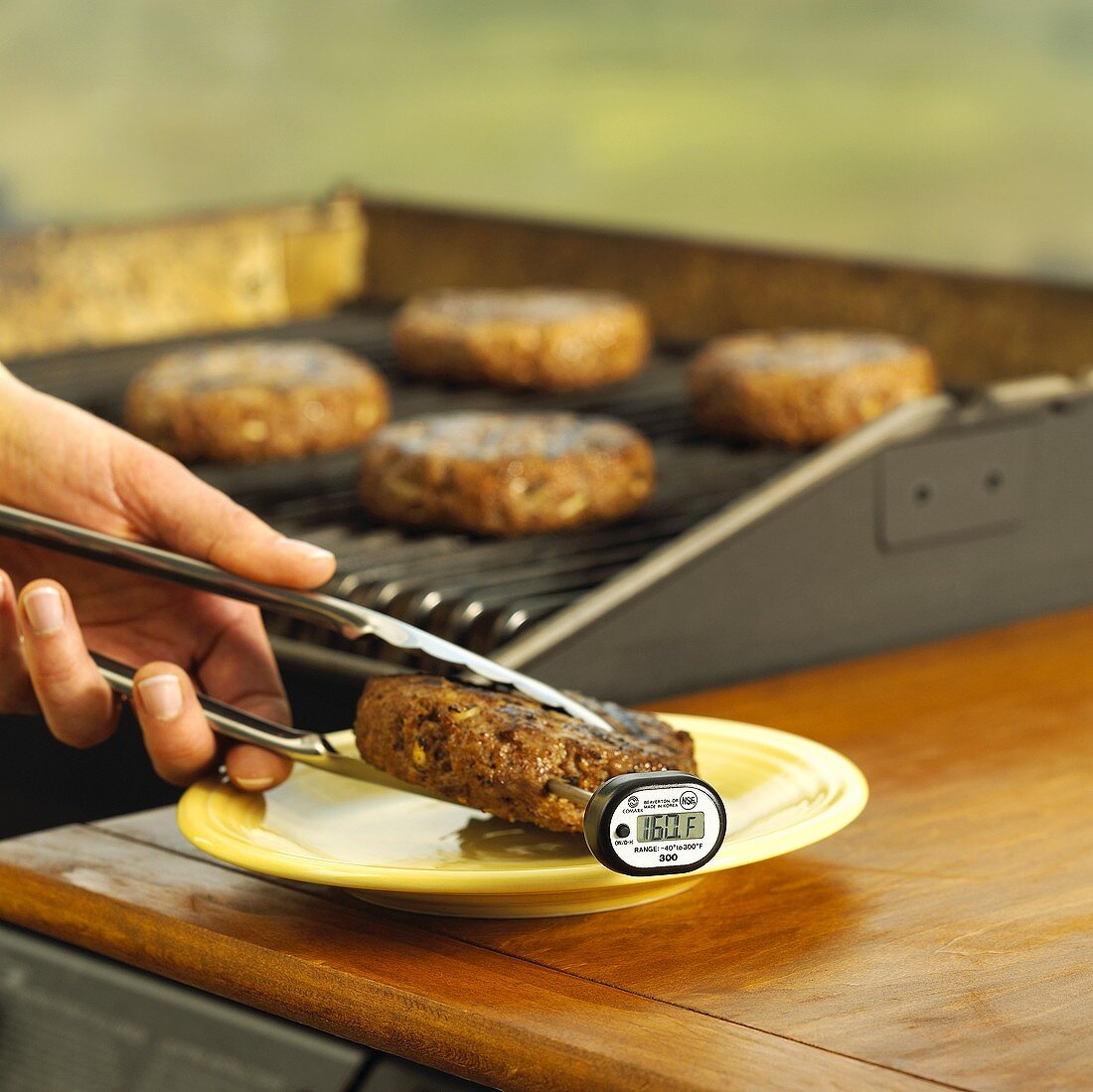Grilled burger with thermometer