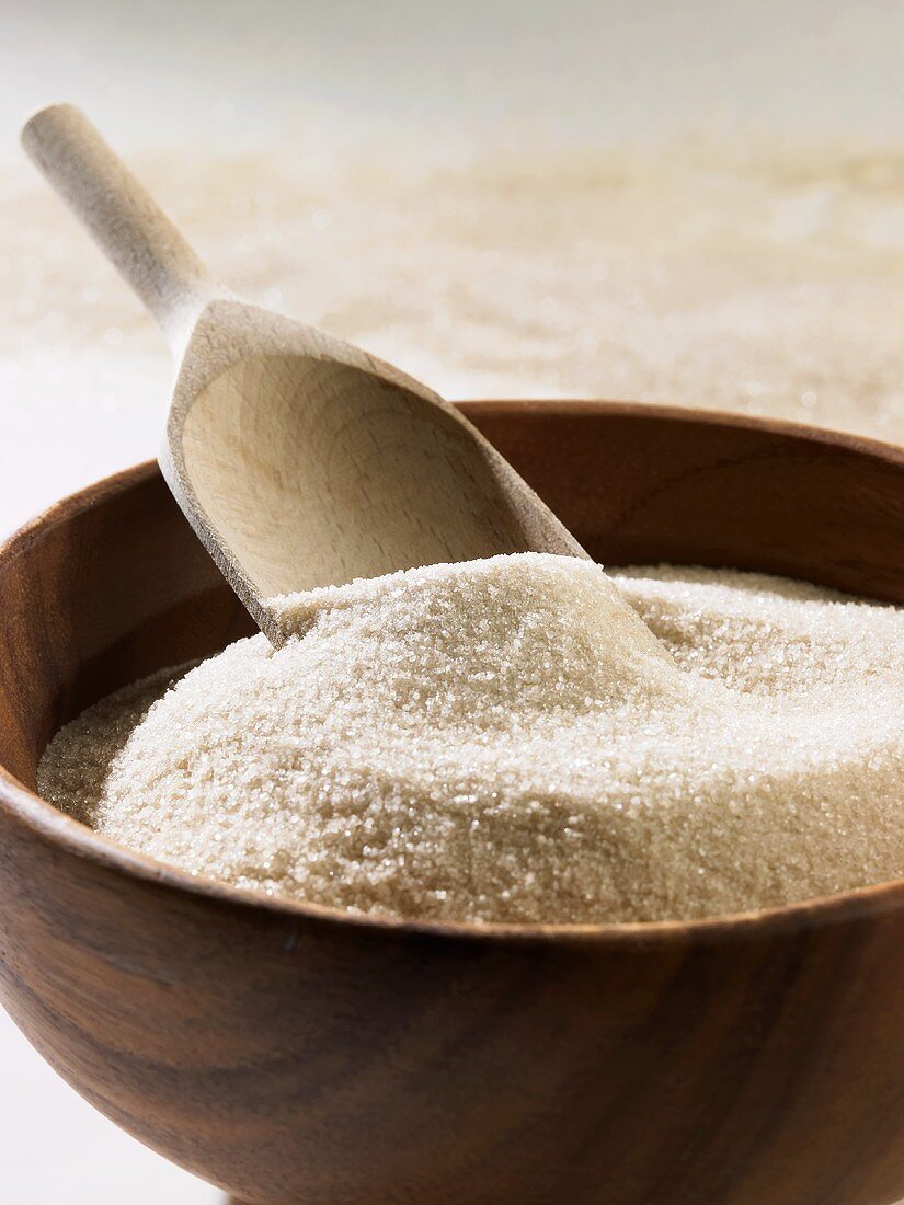 Cane sugar in a wooden bowl