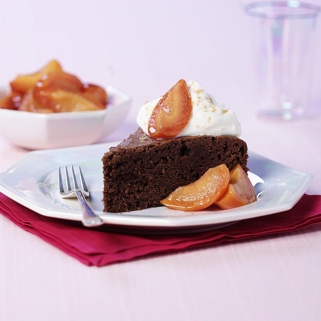 A piece of chocolate cake with peach compote