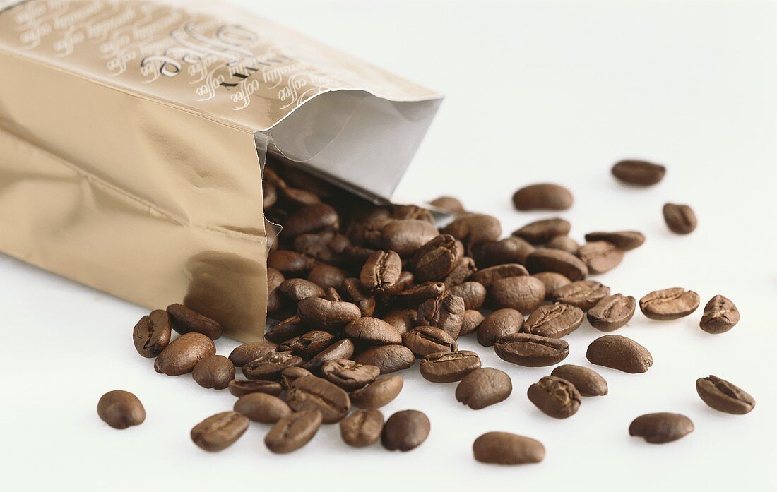 Coffee beans falling out of the packet