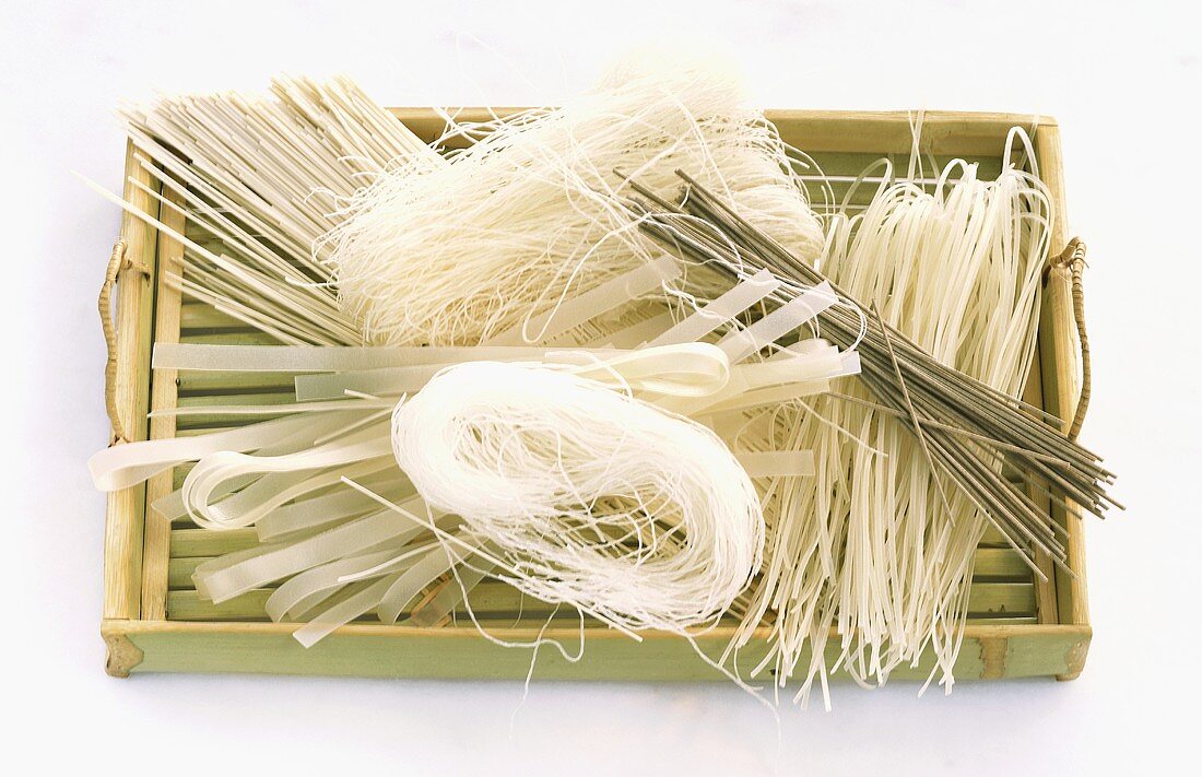 Various Asian noodles on a tray