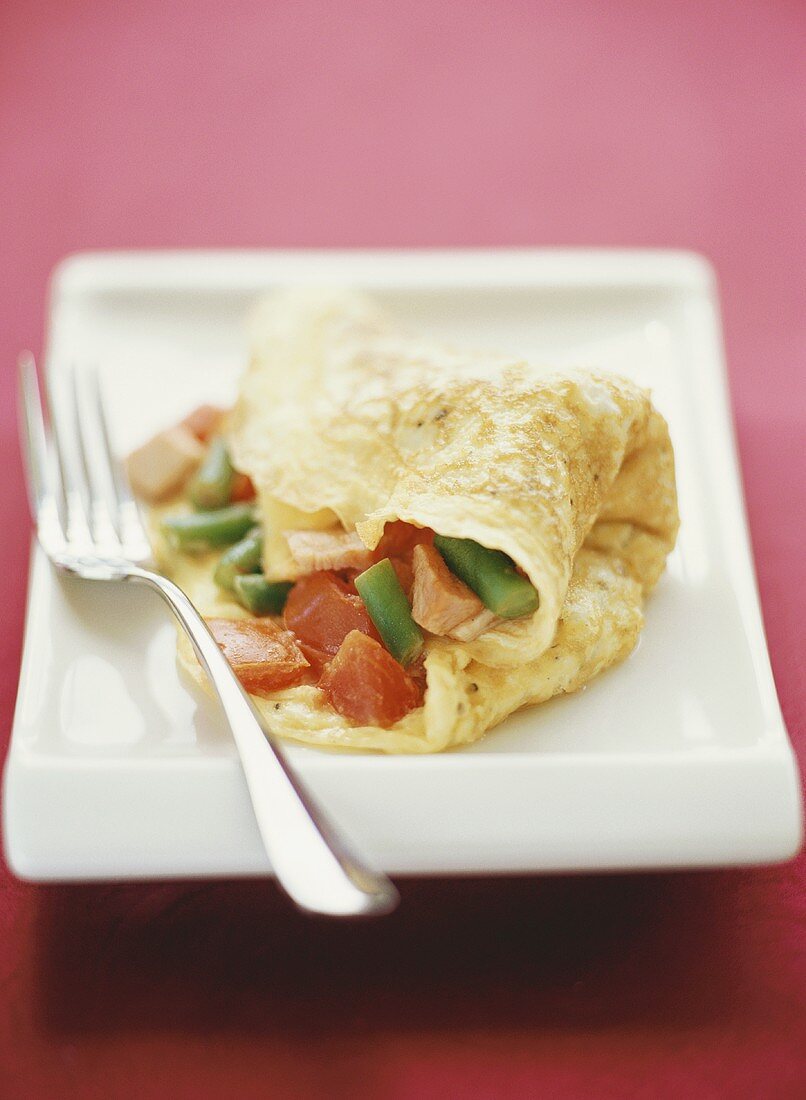 Pancake with ham and tomato filling