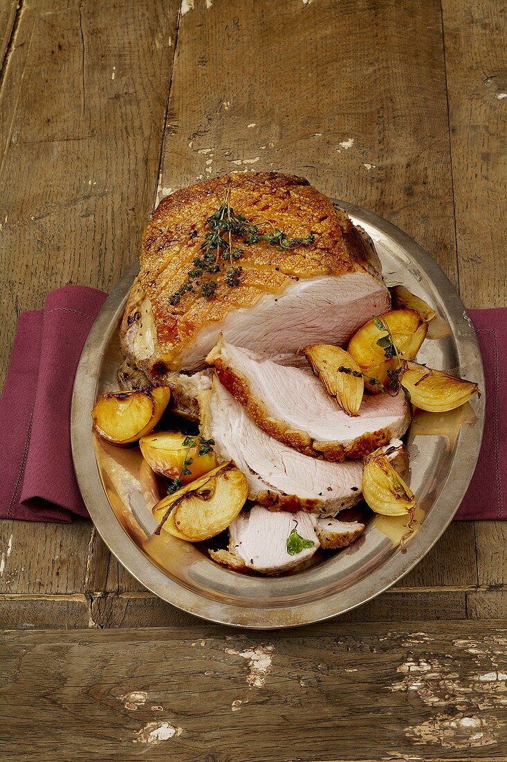 Roast pork with crackling and braised apples