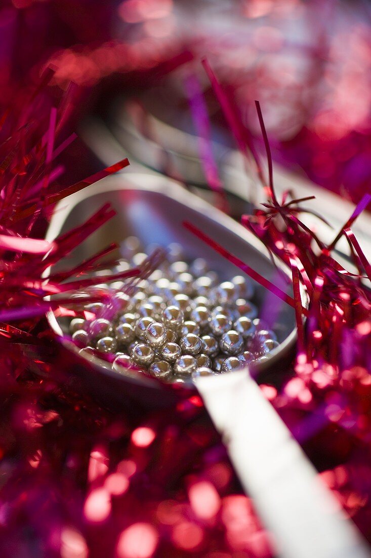 Silver dragees with Christmas decorations