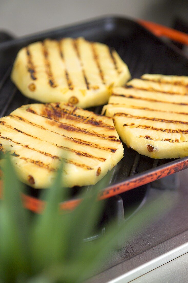 Pineapple slices in a grill pan