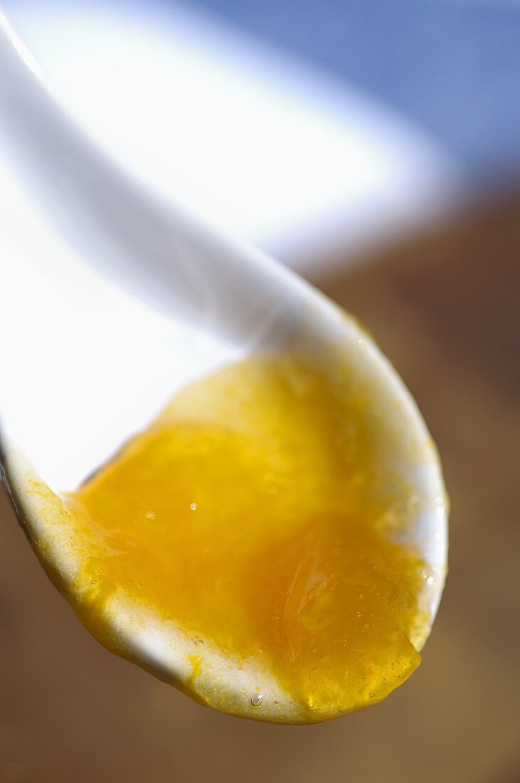 Apricot jam on a spoon